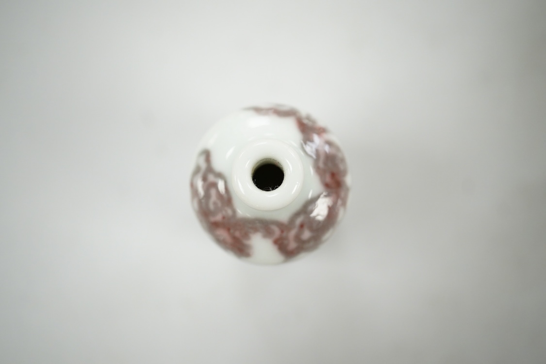 A Chinese cinnabar lacquer snuff bottle, a glass overlay snuff bottle and an underglaze copper red snuff bottle-9cm high (3)